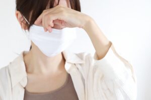 体調不良の女性